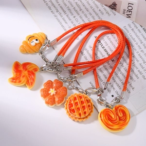Five-piece realistic bread food charms set with orange woven lanyards and lobster clasps