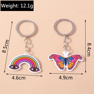 Dettaglio dimensioni dei portachiavi in acrilico con arcobaleno e farfalla colorata