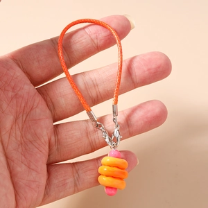 Detail of creative hot dog bun phone charm with orange braided cord and lobster clasp
