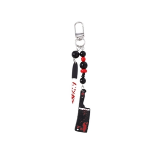 Halloween knife keychain with beaded chain and bloody cleaver charms on white background