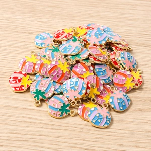 Close-up of colorful round enamel Christmas pendants with gold-plated stars and alloy hooks