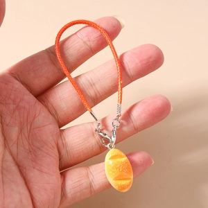 Detail of realistic hot dog bun charm with orange braided strap and silver metal clasp
