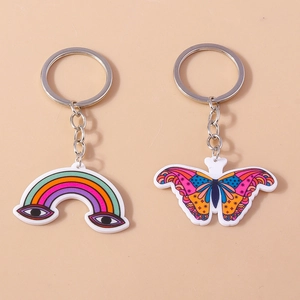 Set portachiavi in acrilico colorato con ciondoli occhio arcobaleno e farfalla su metallo