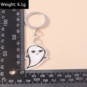 Detail view of cartoon ghost keychain with silver metal ring and 6.1g weight display