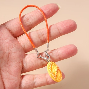 Close-up of a realistic hot dog bread pendant with orange cord and metal lobster clasp