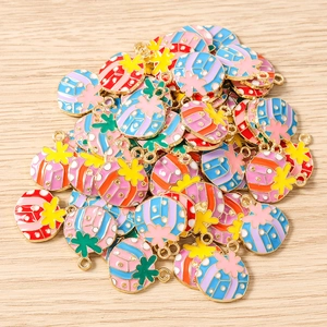 Macro view of colorful enamel cactus pendants with gold plating for DIY jewelry making