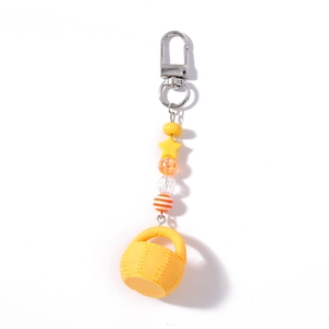 Creative yellow beaded keychain with star charm and woven basket pendant for bags