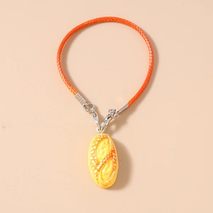 Detailed close-up of realistic hot dog bread charm with orange braided phone strap and metal clasp