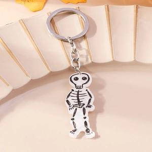 Detailed view of the cute acrylic skeleton pendant on a silver metal keychain