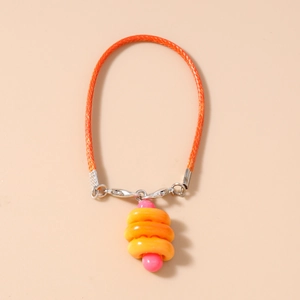 Detail view of fashion hot dog bread phone charm with orange braided rope and metal clasp