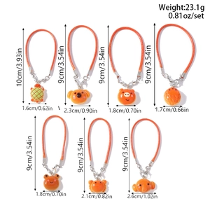 Set of 7 cartoon resin animal charms with orange lanyards and size details shown