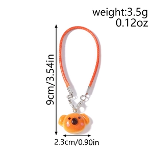 Cute orange koala bag charm with woven rope loop and precise size measurement details