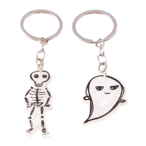 Cute Halloween ghost and skeleton keychains with white acrylic charms on a metal ring