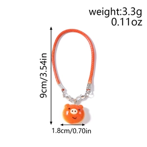 Cute orange pig charm with woven strap and lobster clasp including size measurements