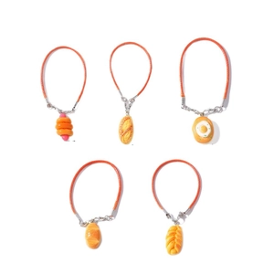 Five styles of realistic food charms including toast and croissant with woven ropes