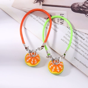 Realistic orange slice fruit pendants with colorful woven straps and metal lobster clasps