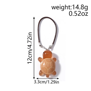 Detail showing amber resin turtle pendant dimensions and measurements on white background