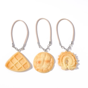 Realistic waffle and pastry bag charms set with beige woven lanyards and silver clasps