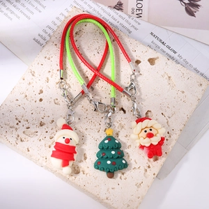 Christmas tree snowman and Santa Claus charms with festive red and green cords