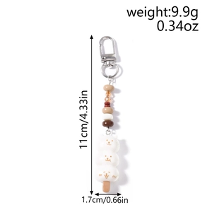 Détail du porte-clés perlé en forme d'animal avec dimensions 11cm de long et poids 9,9g