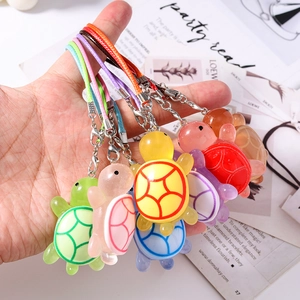 Colorful resin turtle phone charms with matching woven straps and metal lobster clasps