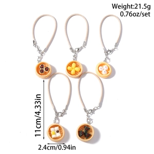 Detailed view of 5 miniature Chinese dim sum charms with measurements and weight