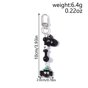 Detailed view of Halloween keychain featuring black cat and spider charms with 10cm size specs