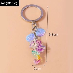 Iridescent seahorse keychain with colorful shell pendants and dimensions detail