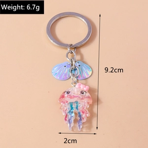 Detail view of octopus jellyfish keychain showing size 9.2cm and weight 6.7g on beige background