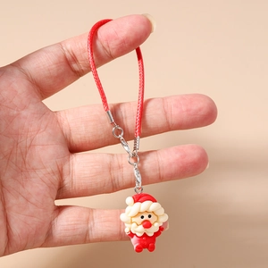 Detailed close-up of a Santa Claus pendant with red woven lanyard and metal lobster clasp