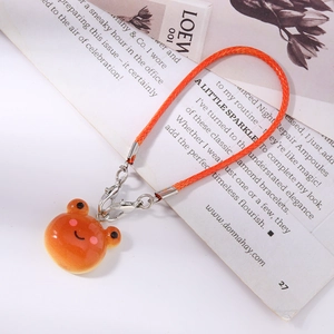 Detailed view of glossy orange cartoon animal pendant with vibrant orange braided rope strap