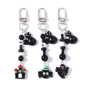 Beaded Halloween keychain set with black cat charms featuring castle spider and ghost motifs