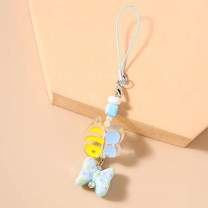 Detail of bee and butterfly phone charms with woven strap and metal lobster clasp