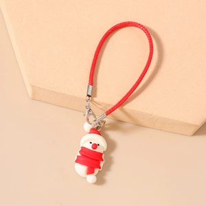 Detail of Christmas snowman phone charm with red woven lanyard and silicone pendant