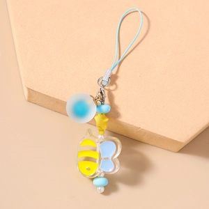 Detail of blue and yellow bee charm with frosted beads and blue lanyard cord