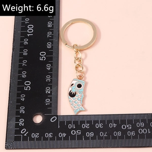 Blue Koinobori koi fish keychain with golden ring measured at 4.5cm and 6.6g weight