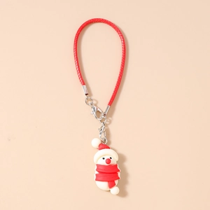 Detailed macro view of a 3D snowman charm with a red braided lanyard and metal clasp