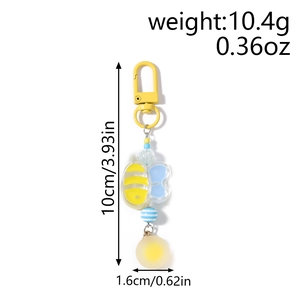 Detail view of a beaded bee keychain showing 10cm length and 10.4g weight measurements
