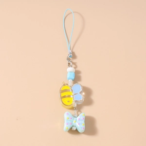Detail of blue bead phone strap featuring cartoon bee charm and polka dot bow pendant