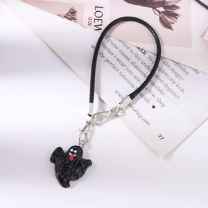Detail of a black ghost phone charm with woven leather strap and silver lobster clasp
