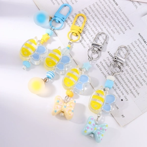 Colorful beaded bee and bow keychain set with star charms and acrylic pendants
