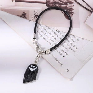 Detail of minimalist black ghost charm with lobster clasp on woven cord for Halloween