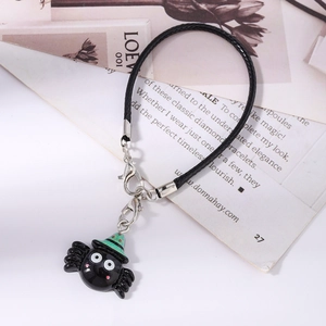 Detail of Halloween spider charm with lobster clasps and black woven lanyard cord
