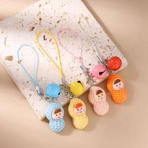 Set of four colorful peanut-shaped cartoon charms with matching bells and woven lanyards