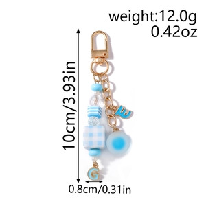 Detailed view of sky blue beaded keychain with gold alloy clasp and enamel letter charms