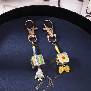 Fashionable beaded gold fish and bow keychain set with colorful acrylic square charms