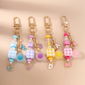Fashionable beaded keychain with acrylic heart beads and metal alphabet letter charms