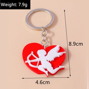 Detail view of cupid heart keychain with dimensions 8.9cm by 4.6cm in red and white colors