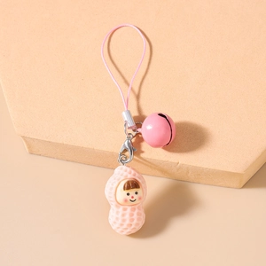 Detailed close-up of a pink cartoon girl peanut pendant with a bell and lobster clasp