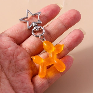 Portachiavi cane palloncino arancione traslucido con gancio a stella in argento